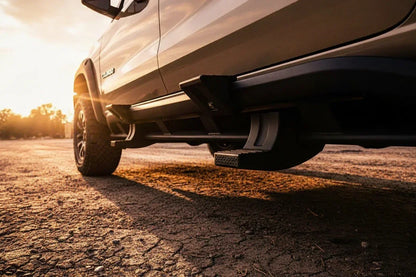 Close-up of snap-on truck sidestep accessory, mounted on off-road vehicle at sunset